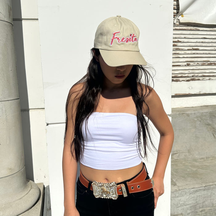 Woman wearing khaki Fresita hat with hair down