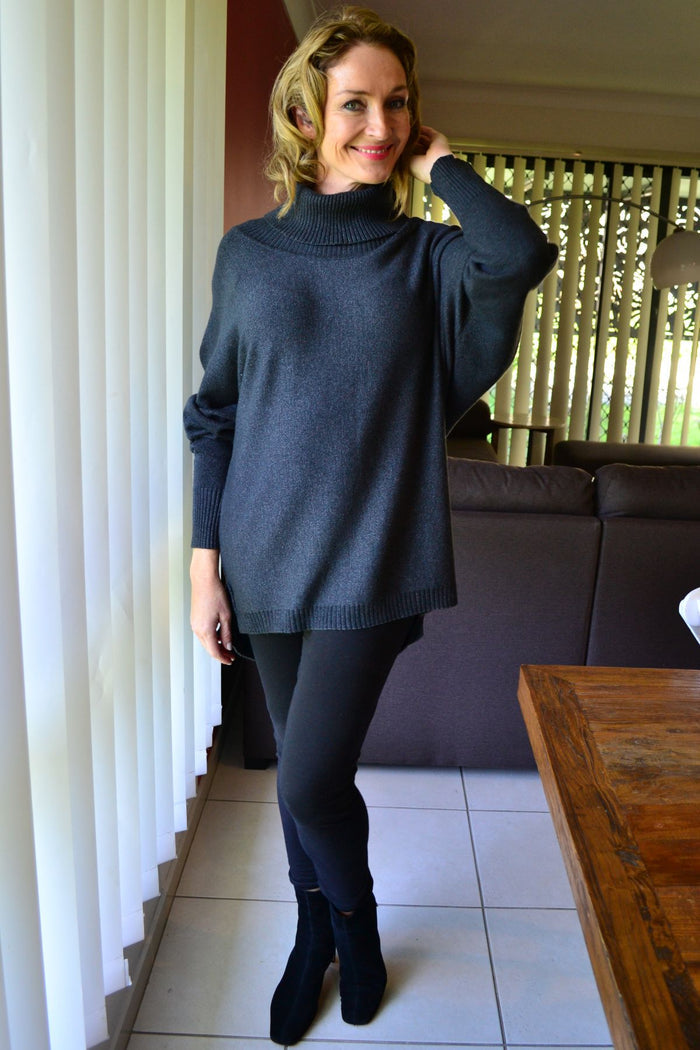 Charcoal grey Whishstone Snuggle Up Tunic Jumper laid flat, showing long sleeves, cozy knit fabric, and relaxed fit.