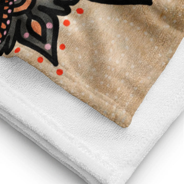 Mandala Beach Towel - The stark contrast of charcoal ink (#1A1A1A) radial symmetry against the faux-weathered parchment beige (#D2C2A6), creating an illusion of ancient textile work.