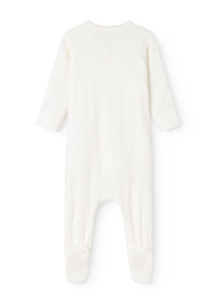 Baby ones in cream white with round neck and long legs at the back.