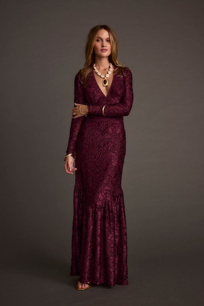 Back view of the velvet maxi dress showing the silhouette and fit.