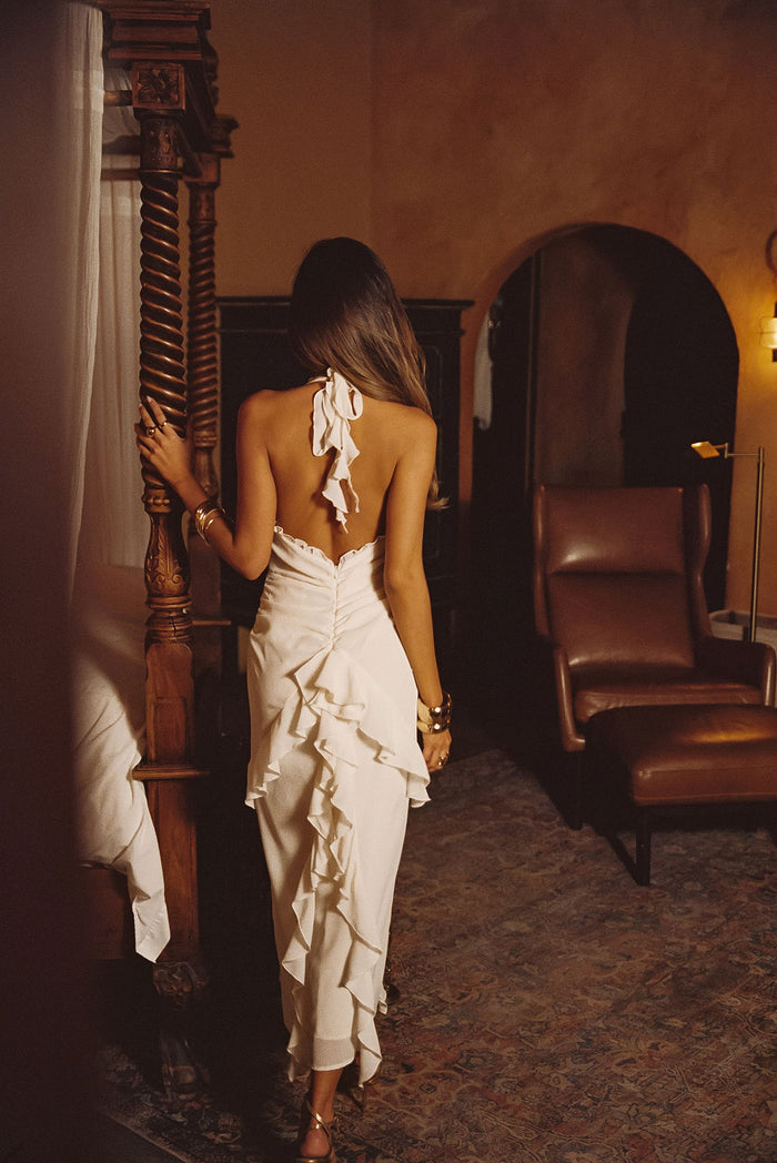 Back view of the cream maxi dress showing the silhouette and fit.