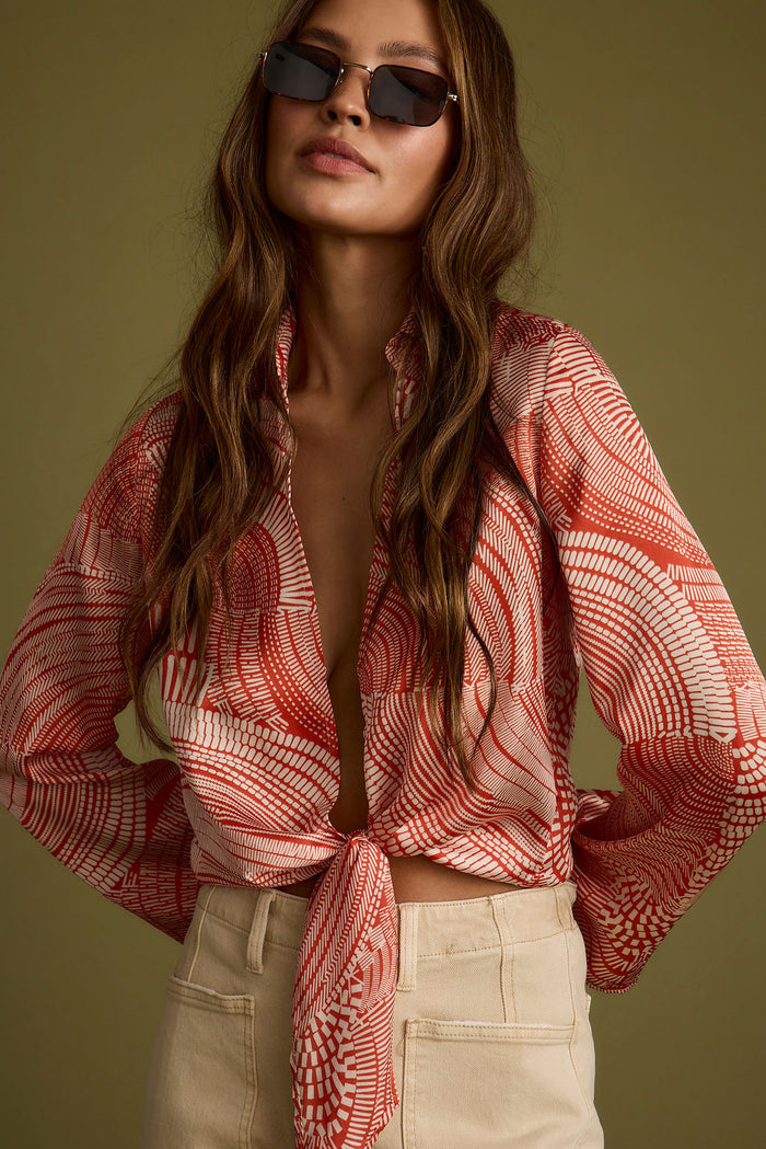 Rust top with elegant accents, a long sleeve sequin top essential.