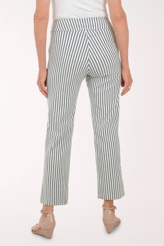 Person wearing a white top and green and white striped pants on a white background