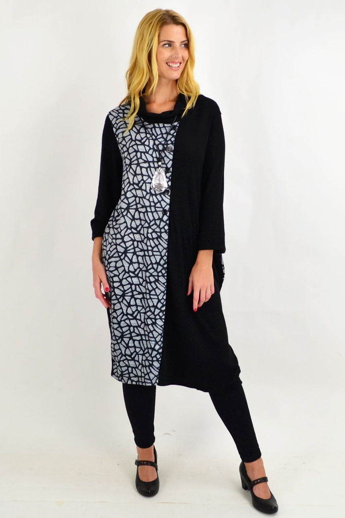 Black warm winter tunic dress by Whispers, featuring a cozy fit and simple design, perfect for cold weather wear.