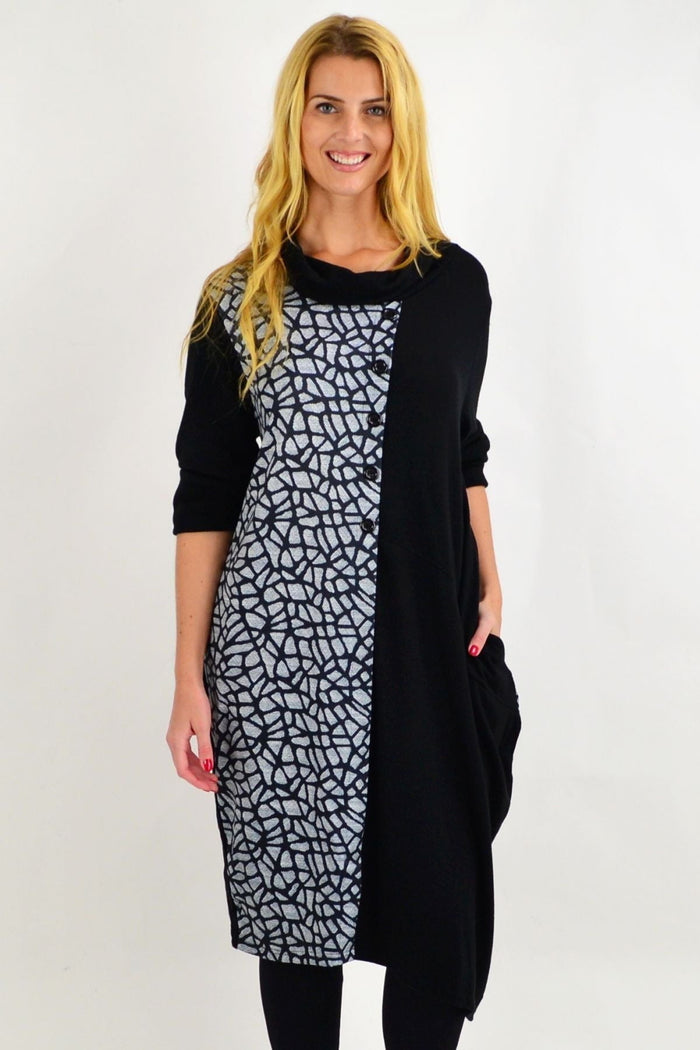 Black Whispers winter tunic dress with long sleeves and a relaxed fit, displayed on a hanger.