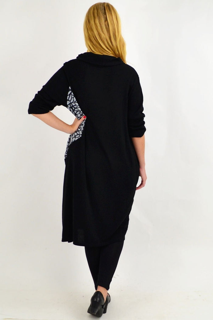 Black winter tunic dress by Whispers, featuring a cozy, long-sleeve design with a relaxed fit and subtle detailing.
