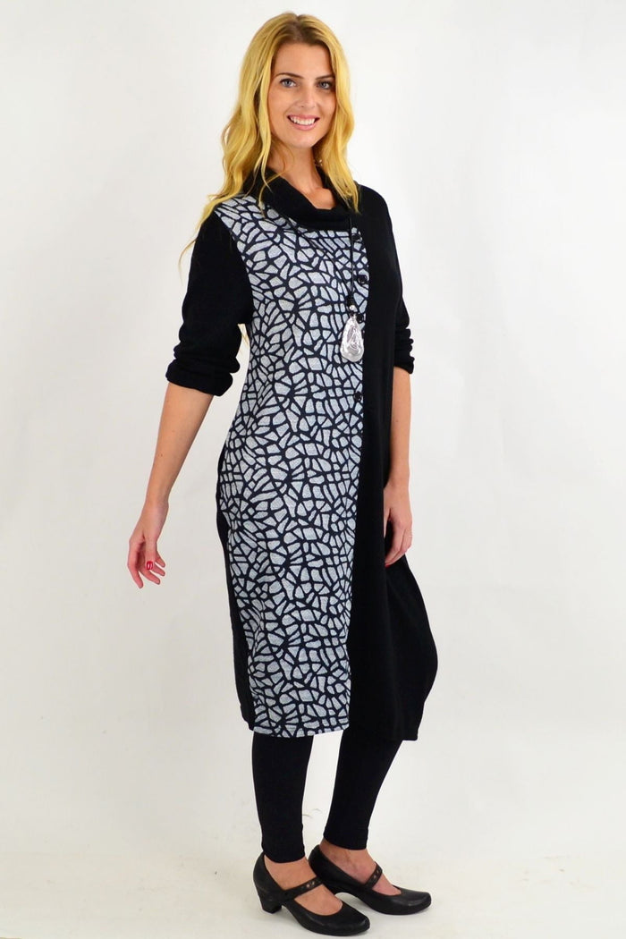 Black Whispers winter tunic dress with long sleeves and cozy fabric, displayed on a mannequin.