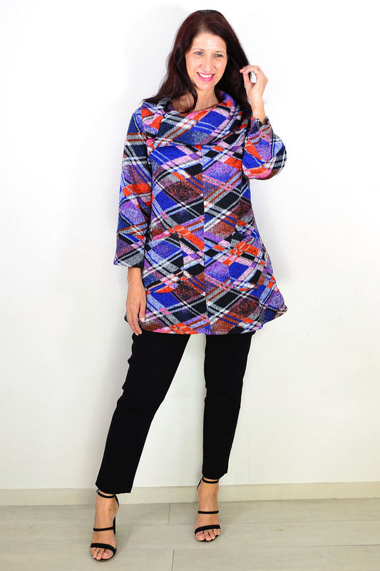 Blue and red geometric patterned winter tunic top by Wishstone, featuring a cozy, stylish design with a relaxed fit.