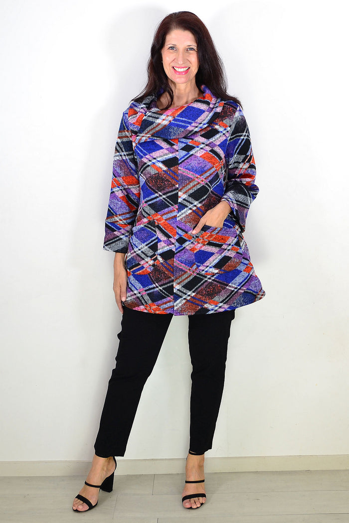 Blue and red geometric winter tunic top by Wishstone, featuring a stylish pattern and cozy fabric, shown on a hanger.