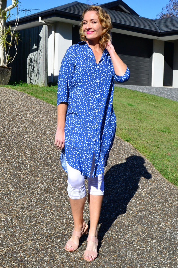 Blue and white spot long tunic shirt by Hourglass, featuring a relaxed fit and button-down front, displayed on a hanger.