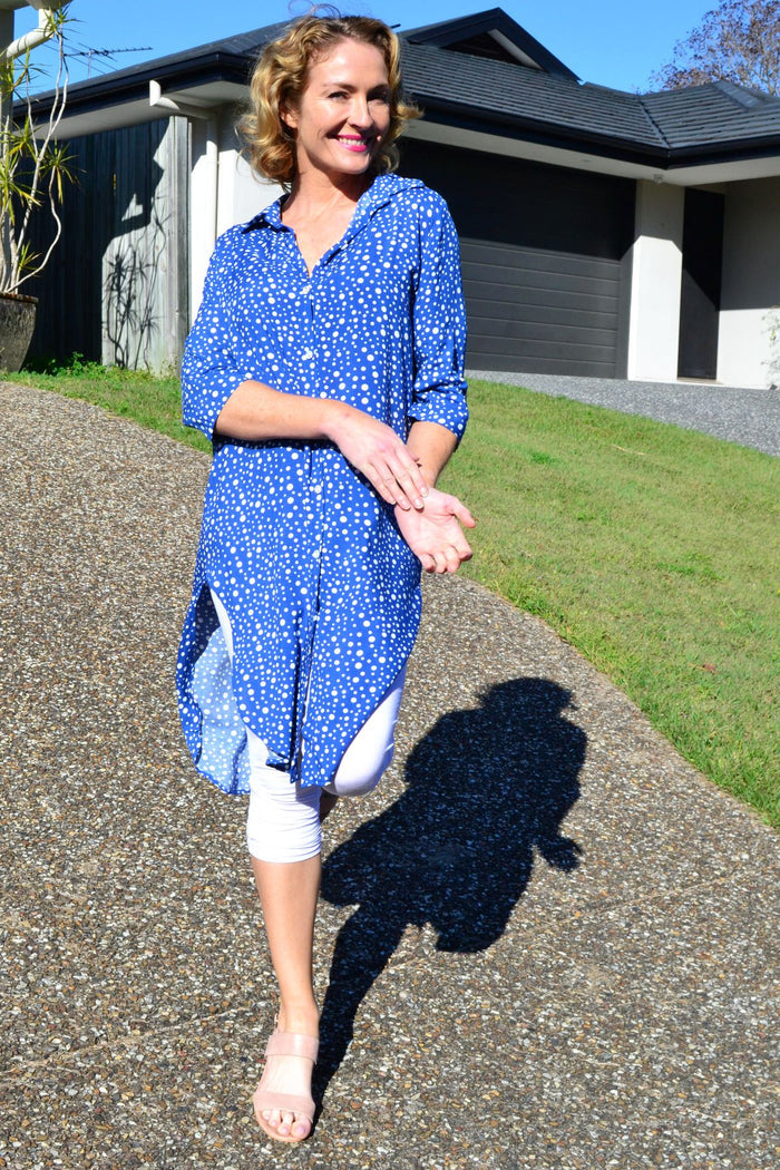 Blue and white spot long tunic shirt by Hourglass, featuring a relaxed fit and button-front design, displayed on a hanger.