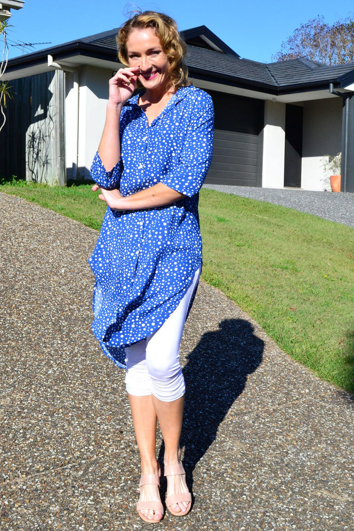 Blue and white spot long shirt tunic by Hourglass, featuring a relaxed fit and button-front design on a model.
