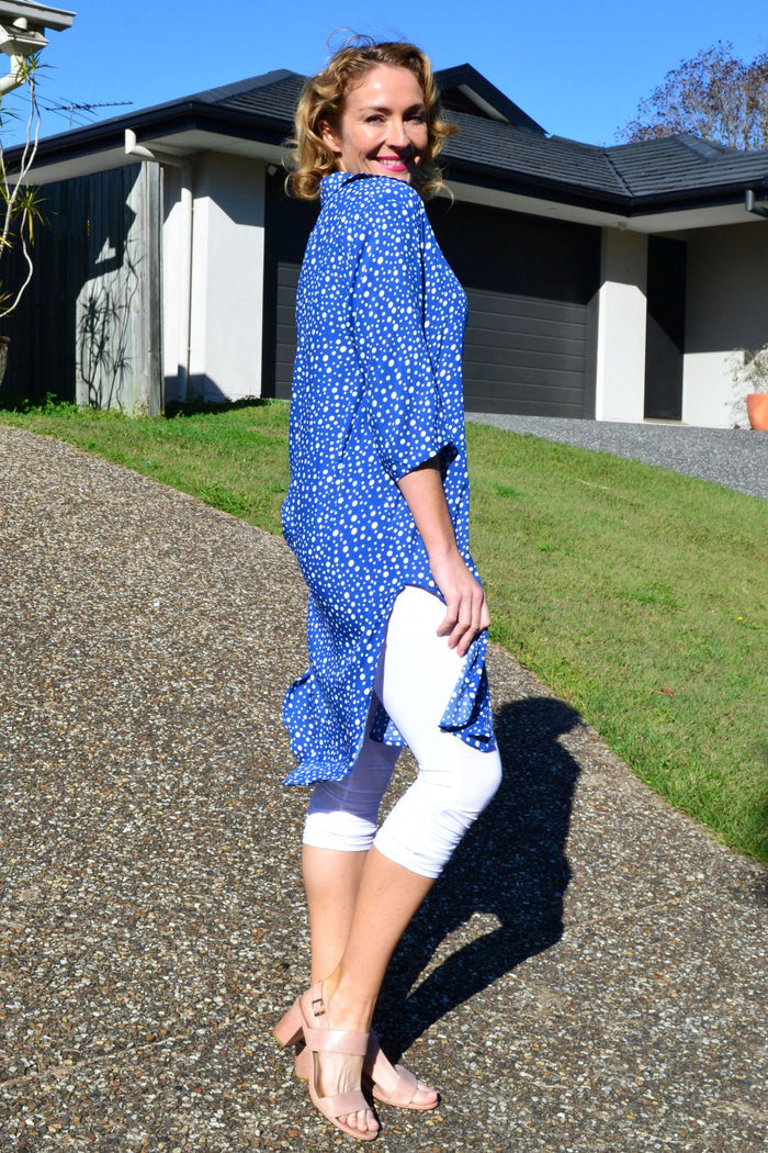 Blue and white spotted long tunic shirt by Hourglass, featuring a relaxed fit and stylish design, shown on a hanger.
