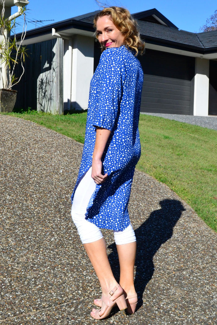Blue and white spot long shirt tunic by Hourglass, casual style with button details and a loose fit, displayed on a hanger.