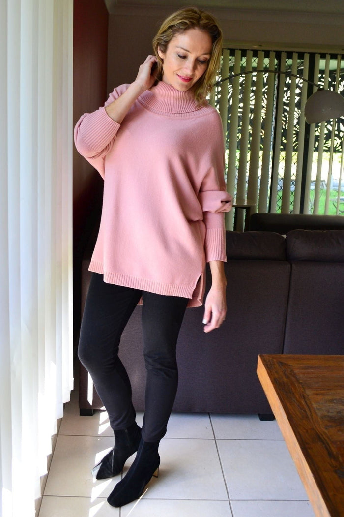 Blush pink Whishstone snuggle-up tunic jumper with cozy knit fabric, round neckline, and long sleeves, displayed on a hanger.