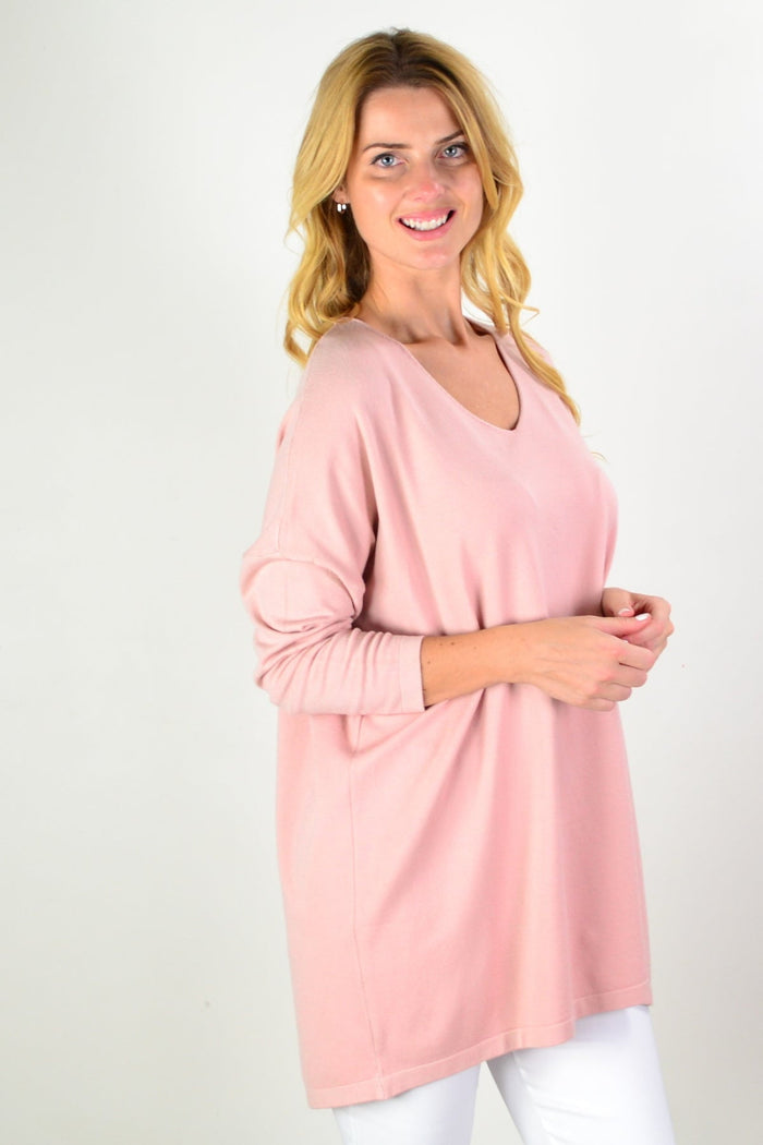 Blush pink wool blend fine knit tunic top by Cali&Co featuring a relaxed fit and long sleeves, displayed on a hanger.