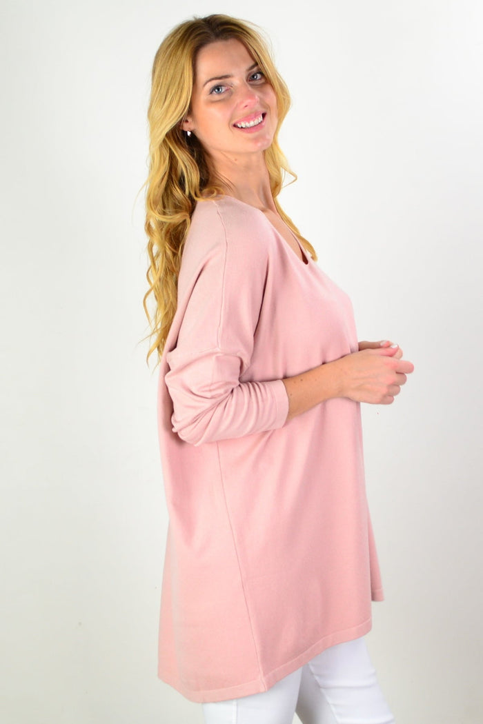 Blush pink wool blend fine knit tunic top by Cali&Co, featuring a cozy, soft texture and a relaxed fit on a model.
