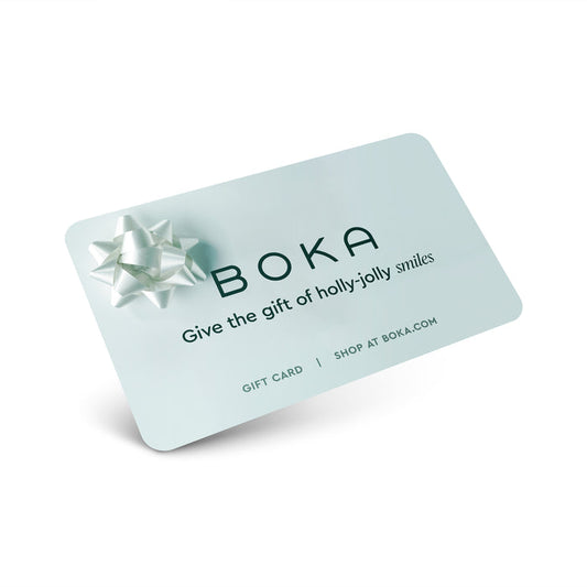 Boka E-Gift Card with a silver bow and the text Give the gift of holly-jolly smiles at boka.com.