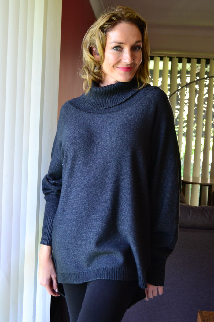 Charcoal grey Whishstone Snuggle Up tunic jumper with long sleeves and cozy fit, displayed on a hanger.