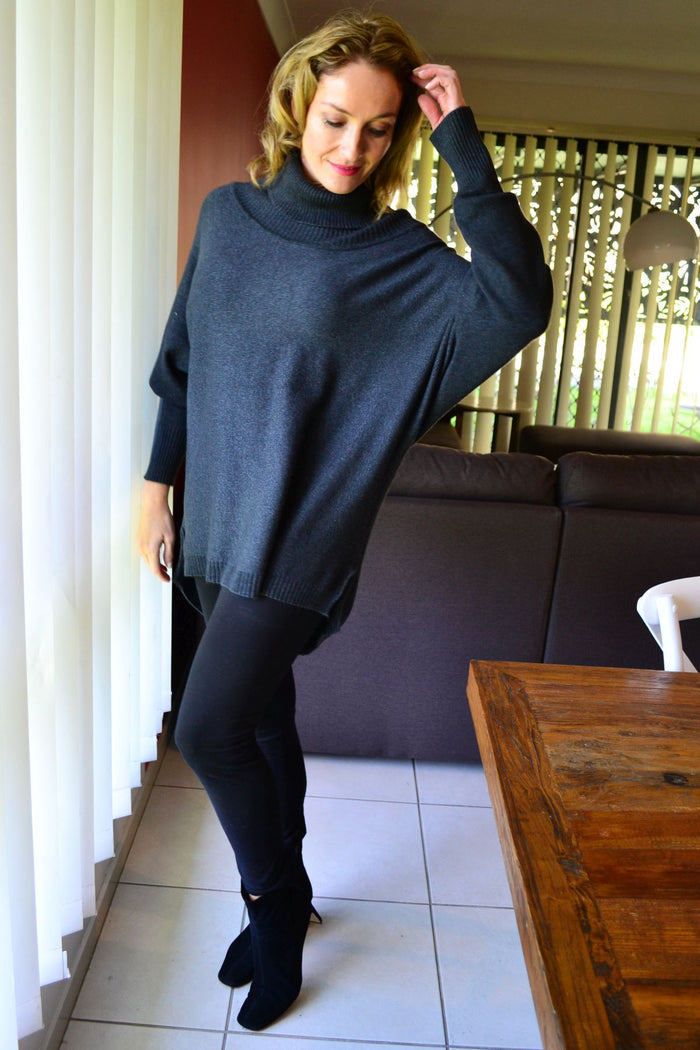 Charcoal grey Whishstone Snuggle Up Tunic Jumper displayed on a hanger, showcasing its cozy, relaxed fit and soft fabric.