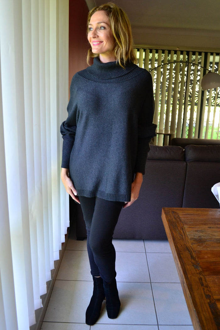 Charcoal grey Whishstone Snuggle Up Tunic Jumper laid flat, showing its cozy, relaxed fit and soft knit fabric for women.
