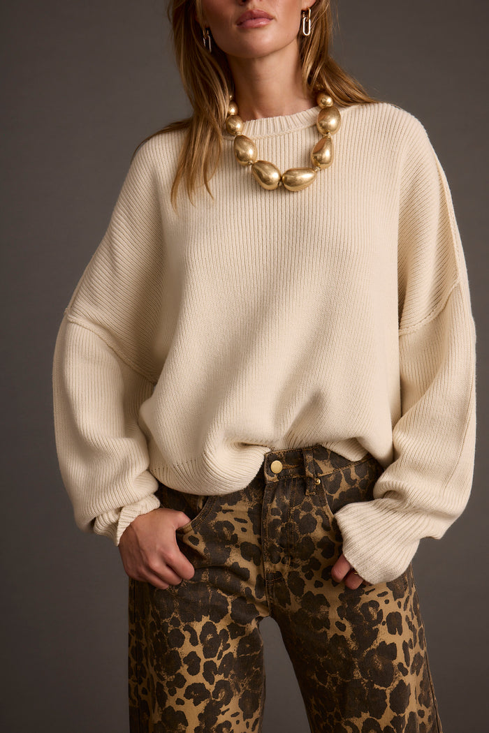Chelsea Cream Sweater paired with complementary accessories for a polished look.
