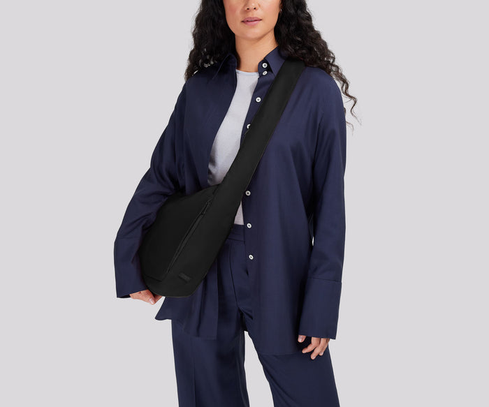 Person wearing the Featherlight Crossbody
// Model is 5’7”