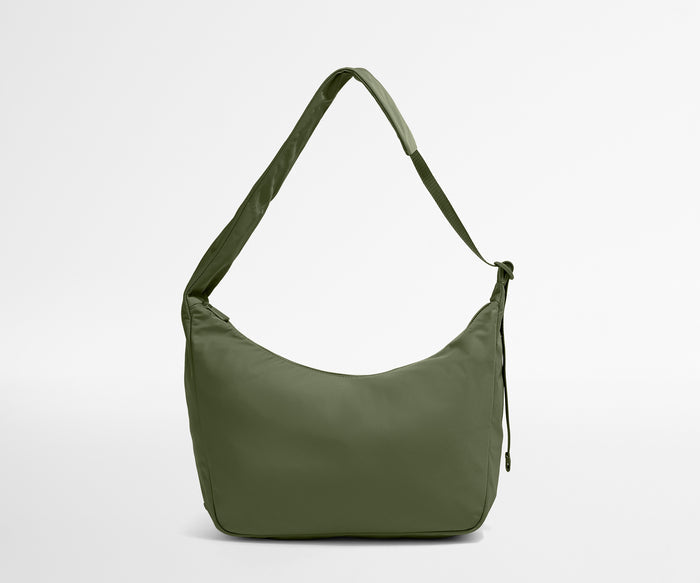 Green shoulder bag on a light gray background