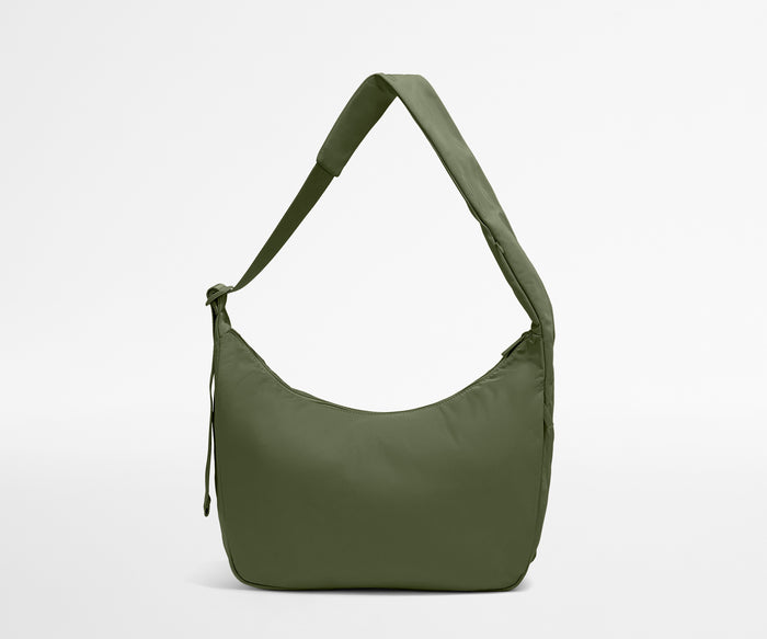 Green shoulder bag on a light gray background