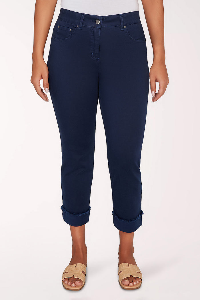 Navy blue pants worn by a person on a white background