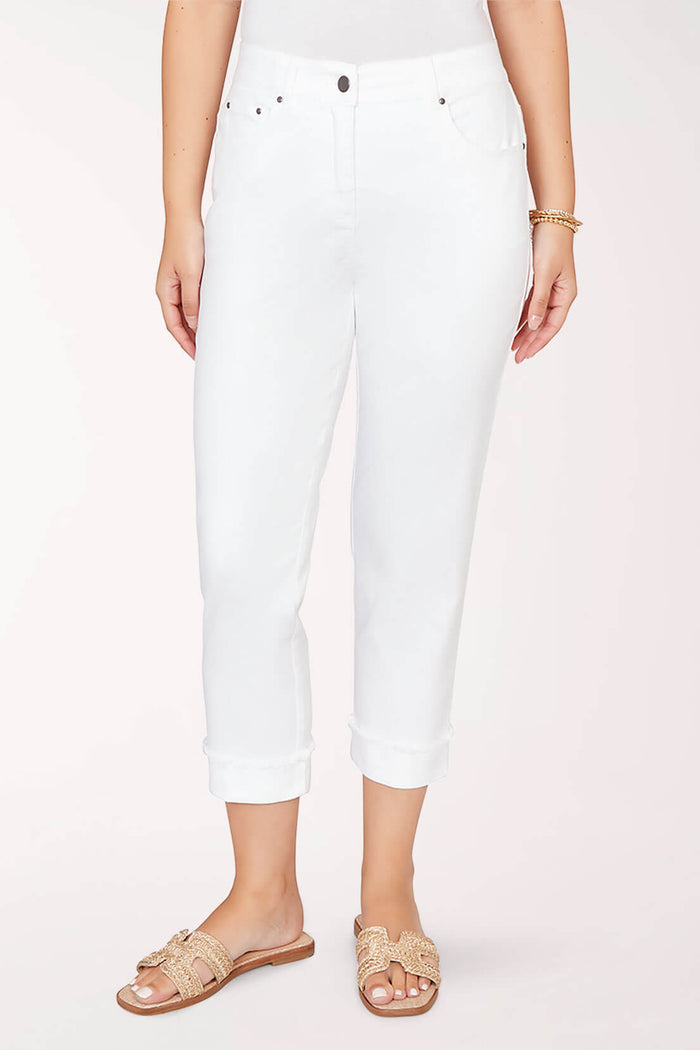 White pants worn by a person on a white background