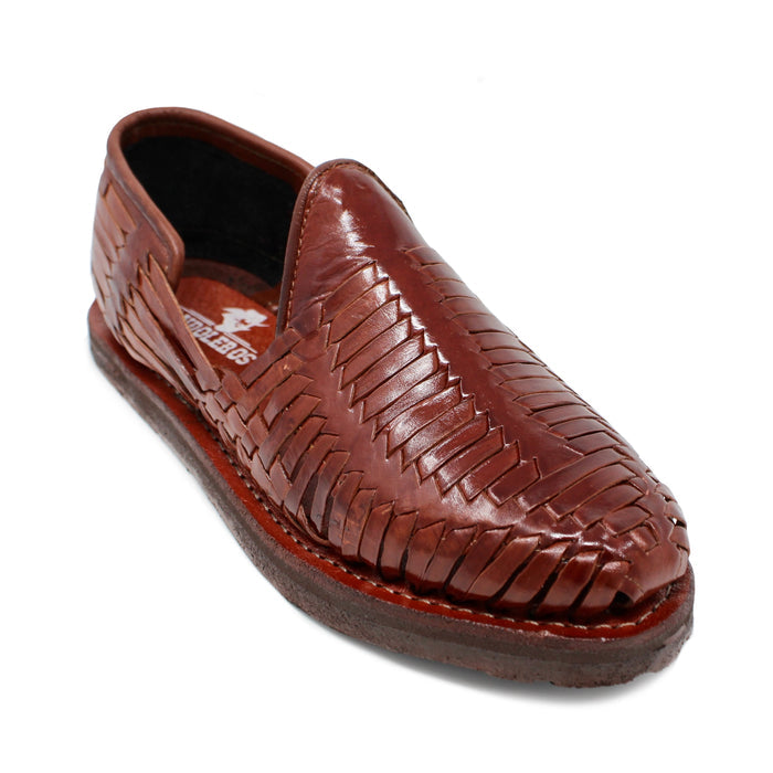 Men's handmade brown genuine leather huarache sandals featuring traditional woven Mexican craftsmanship, closed-toe slip-on design, leather-lined interior, cushioned footbed, and durable flexible outsole for everyday comfort.