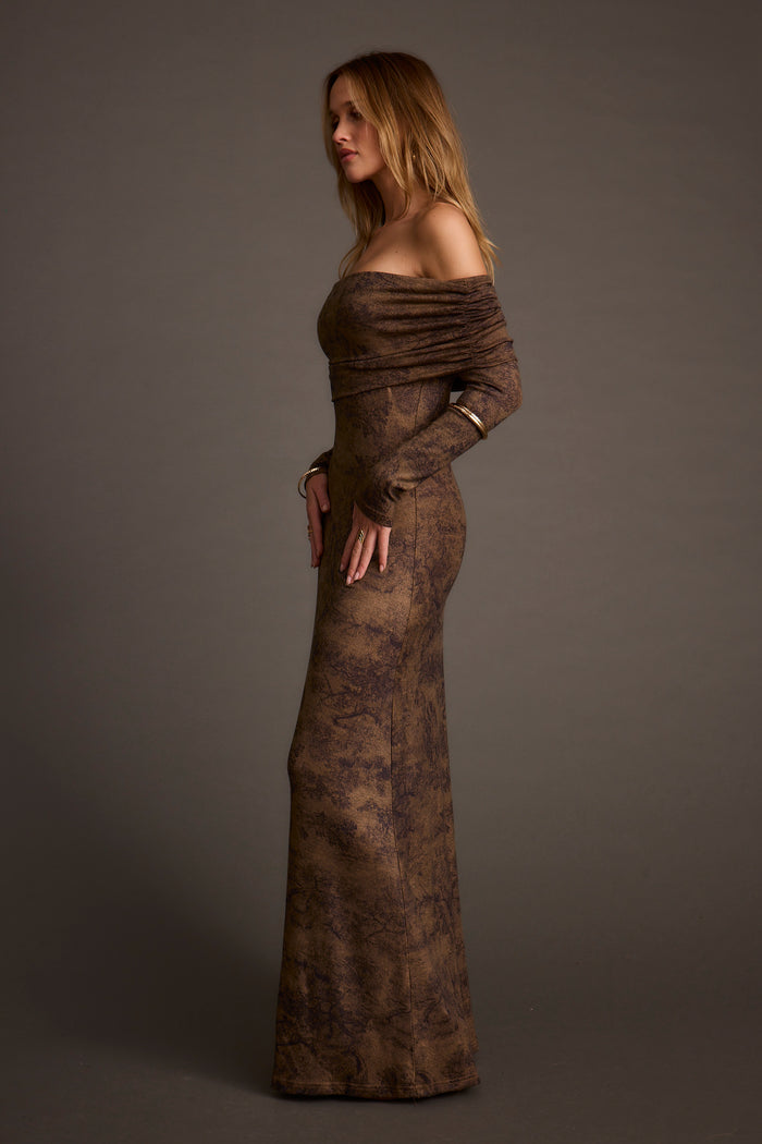Full-length view of the mocha maxi dress showing the drape and movement.