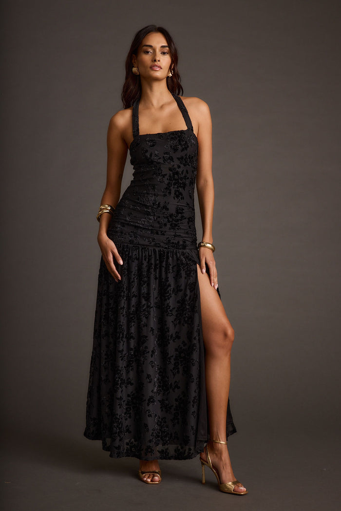 Back view of the black maxi dress showing the silhouette and fit.