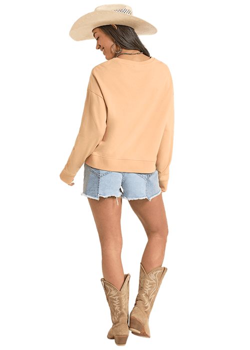 Woman in BW91T08105 sweatshirt, denim shorts, and cowboy boots