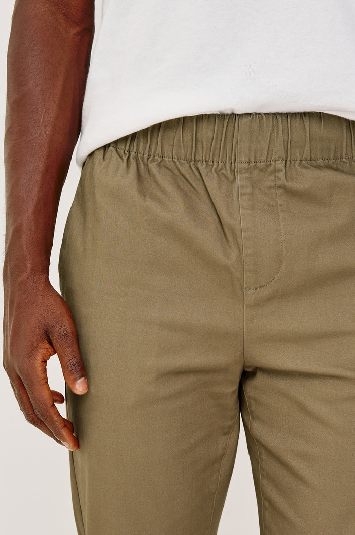 Julian Relaxed Slim Pant in Cotton Blend With Elastic Waist, Back Welt Pockets, and Garment-Dyed for Lived-in Look in Barley Colorway - Lower Body Front Detail View Featured on Model