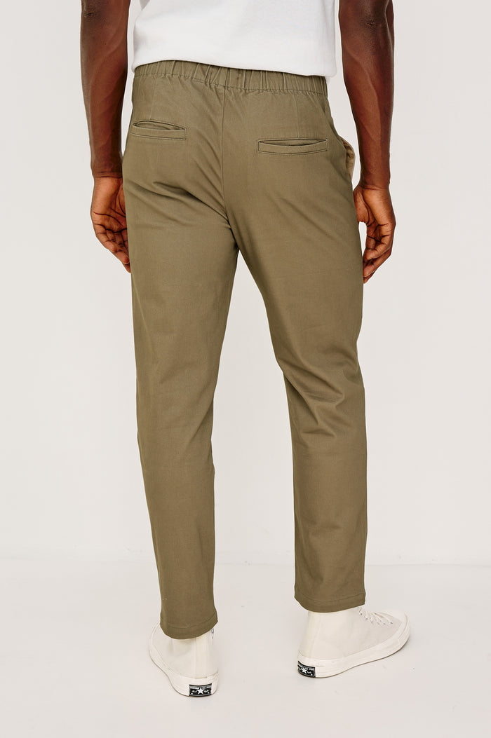 Julian Relaxed Slim Pant in Cotton Blend With Elastic Waist, Back Welt Pockets, and Garment-Dyed for Lived-in Look in Barley Colorway - Lower Body Back View Featured on Model
