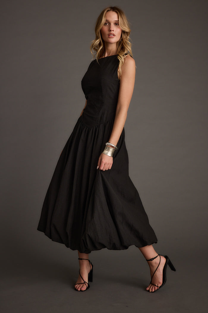 Kate Black Drop Waist Bubble Hem Midi Dress paired with complementary accessories for a polished look.