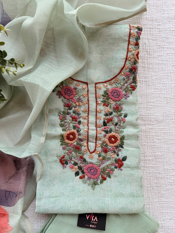 Light green neck emb suit material