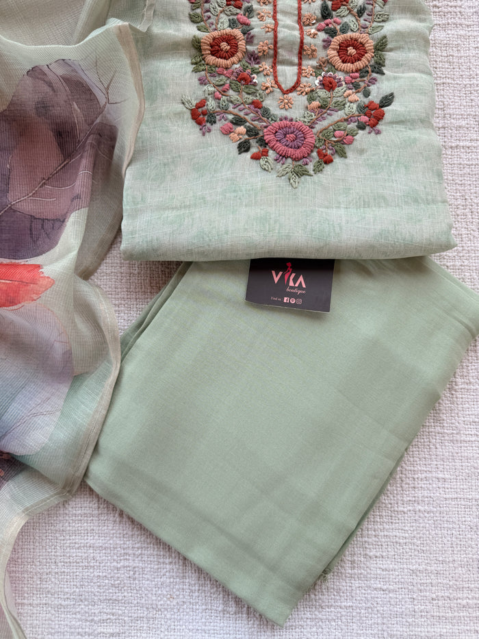 Light green neck emb suit material