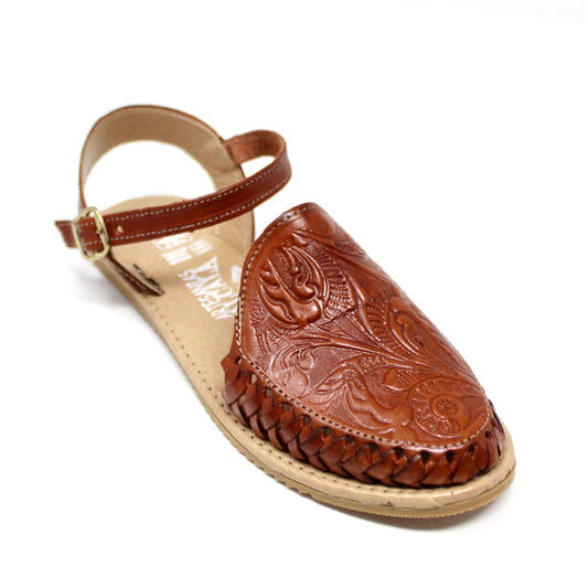 Women's handmade genuine leather artisan huarache sandals featuring a woven leather upper, adjustable ankle buckle strap, cushioned leather footbed, and durable rubber outsole, handcrafted in Mexico for everyday comfort and style.