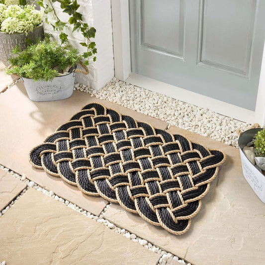 Lovers Knot black outdoor mat- featuring a rope design.