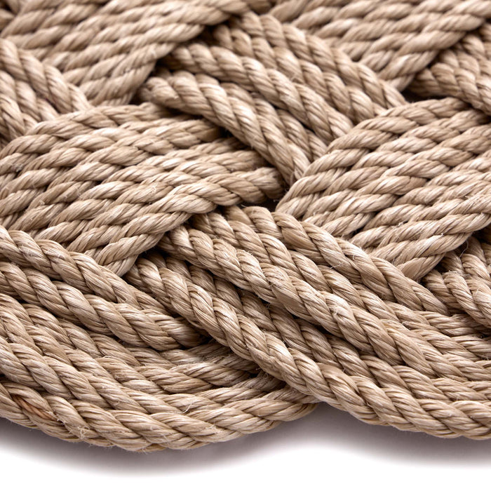 Lovers Knot Outdoor Sand- featuirng a knotted pattern in beige.
