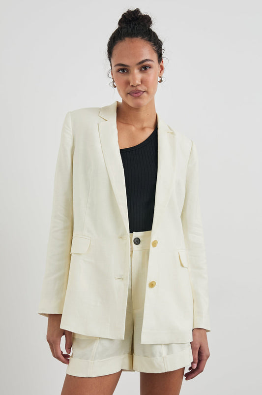 Lucienne Jacket with Two Button Closure, Two Front Flap Pockets, Four-Button Cuffs and Notched Lapels in Lotus Colorway - Front View Featured on Model