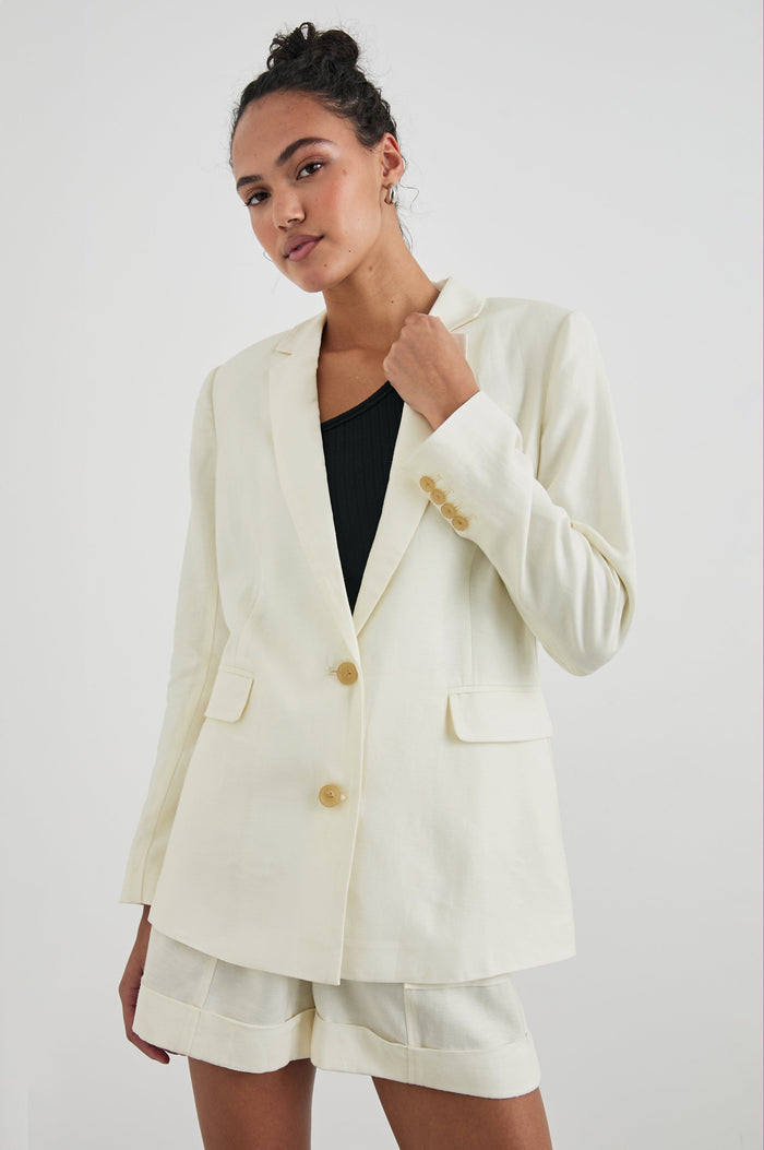 Lucienne Jacket with Two Button Closure, Two Front Flap Pockets, Four-Button Cuffs and Notched Lapels in Lotus Colorway - Front View Featured on Model