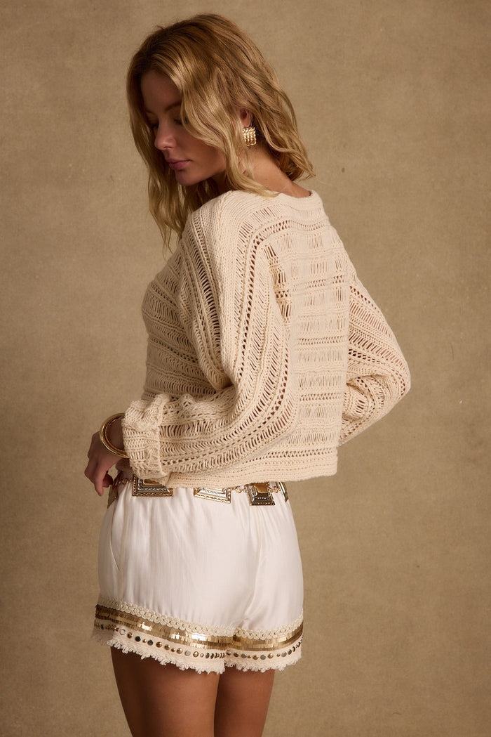 Marela Cream Crochet Sweater styled in a complete look from an alternate angle.
