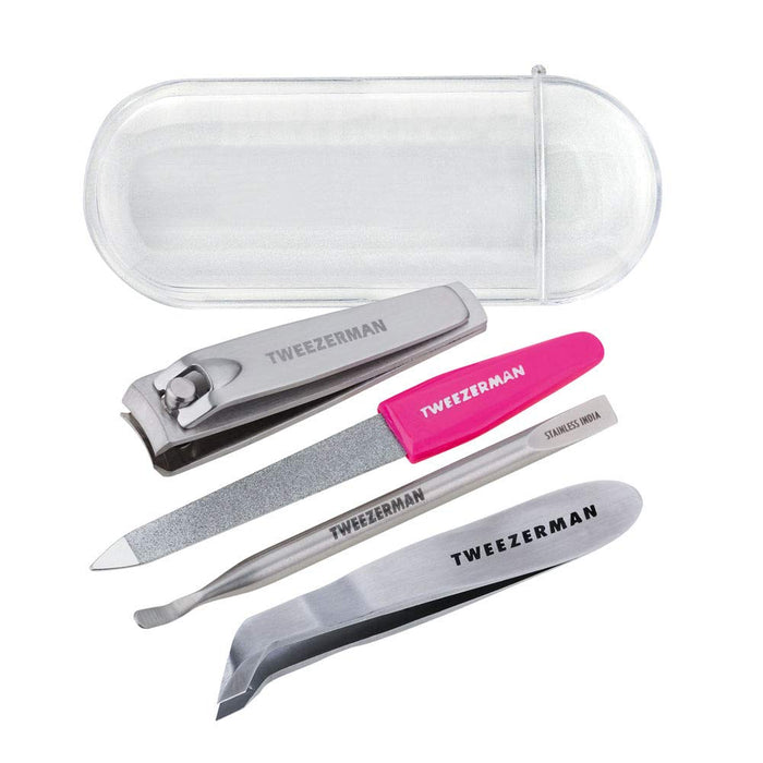 Mini Nail Rescue Kit | Tweezerman featuring stainless steel nail clippers, nail file with pink handle, angled tweezers, and slanted tweezers in a clear protective case, ideal for nail care and wellness.