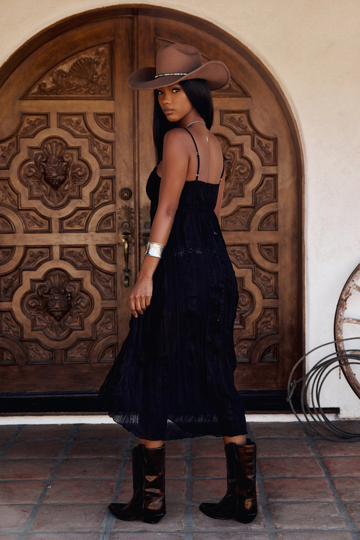 Back view of the black top showing the silhouette and fit.