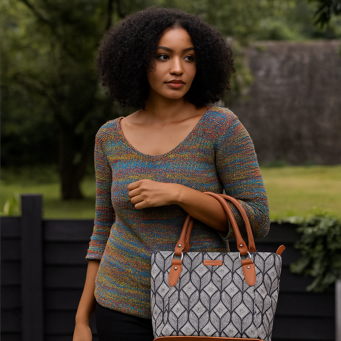 Women’s monochrome printed canvas tote bag with vegan leather handles-model image